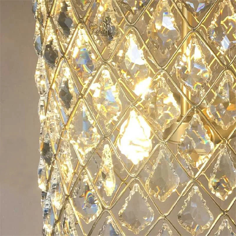 Close-up of a gold and crystal chandelier