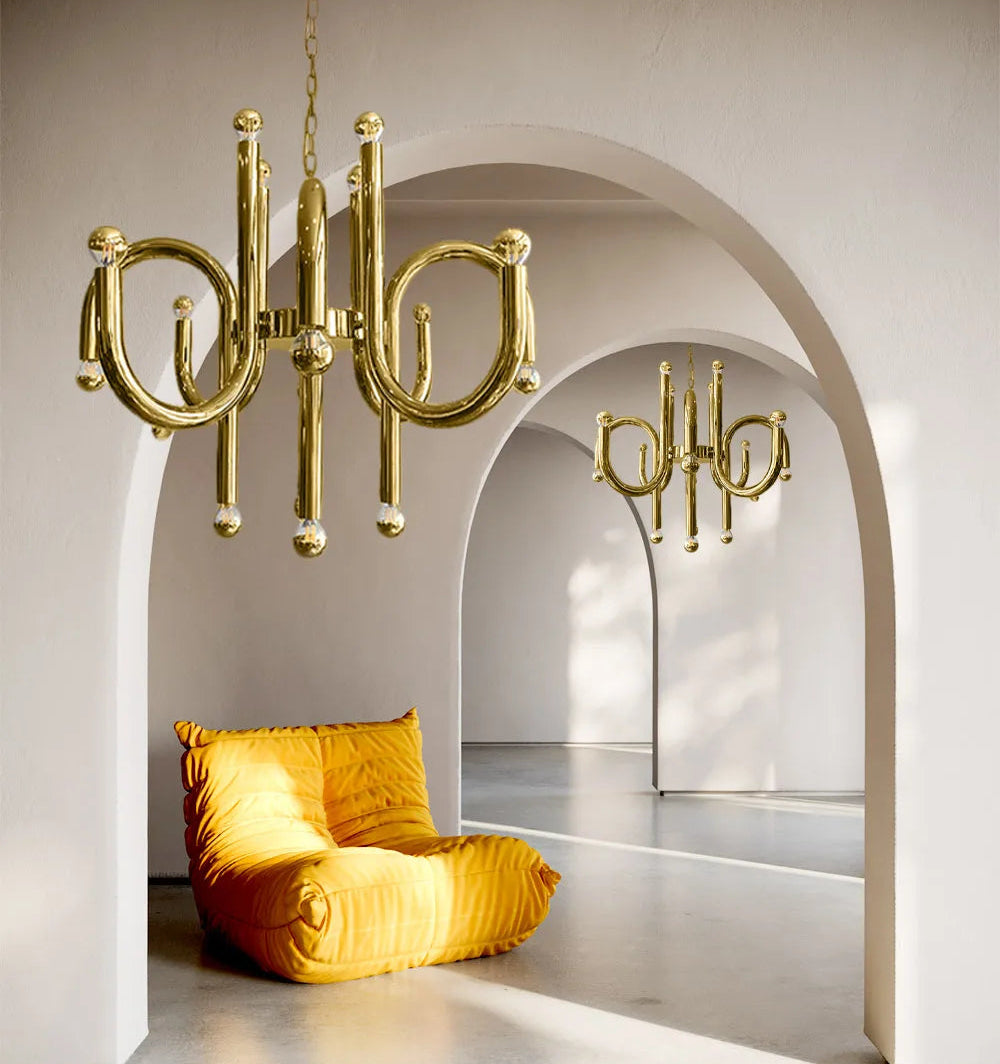 Gold chandelier and chair in a modern interior setting