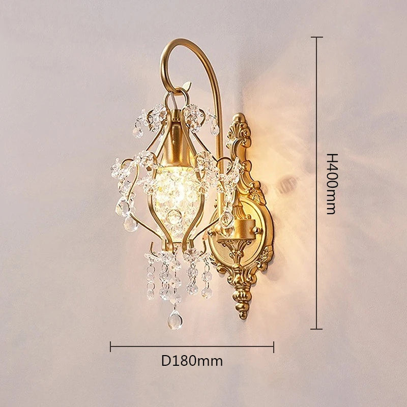 A gold crystal wall sconce with dimensions indicated: height 400mm and diameter 180mm, displayed against a softly lit wall.