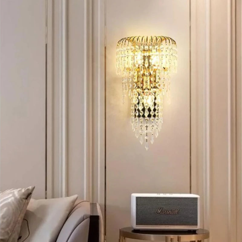 Decorative wall sconce with crystal details in a room setting.