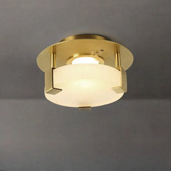 Gold geometric flush mount ceiling light with frosted glass diffuser and crystal accents, viewed from below.