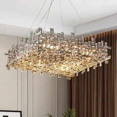 A view of the polished chrome crystal chandelier from a slightly lower angle, highlighting its rectangular form and faceted crystal details.