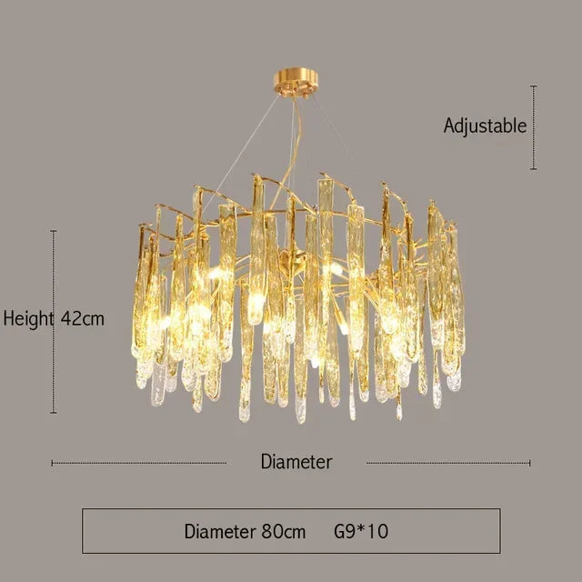 Gold chandelier with dimensions on a gray background
