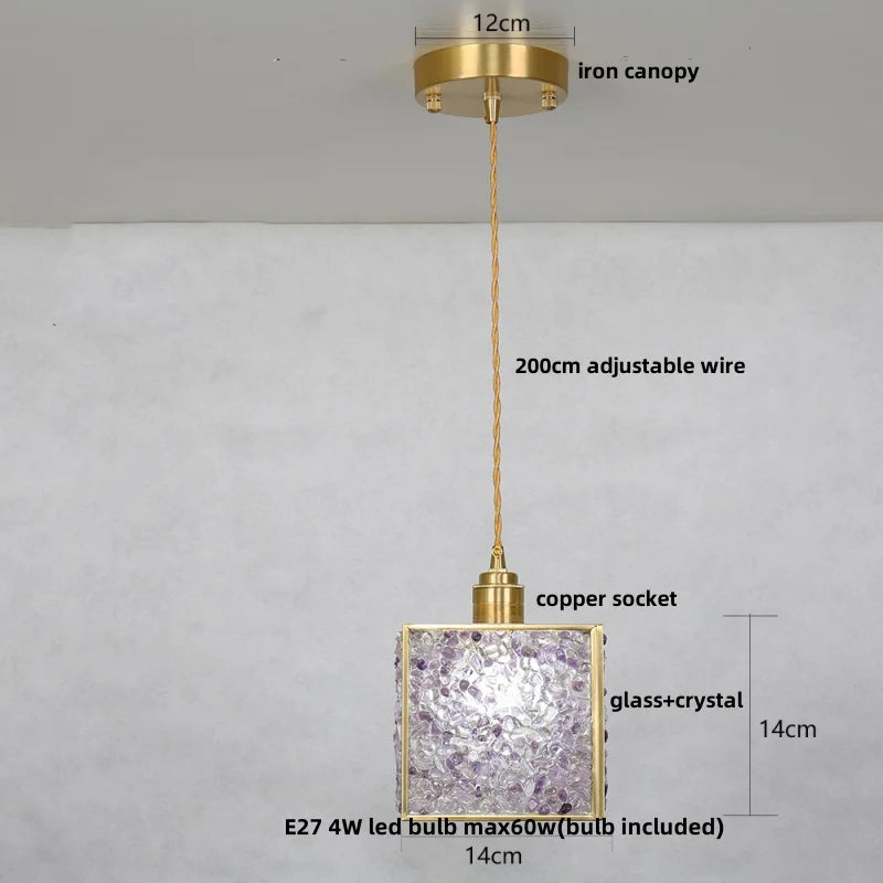 Gold pendant light with measurements on a gray background