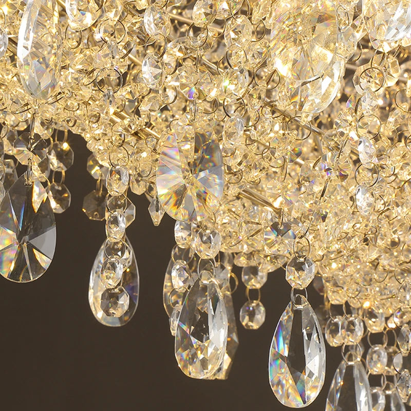 Close-up of a crystal chandelier with clear and gold crystals on a dark background