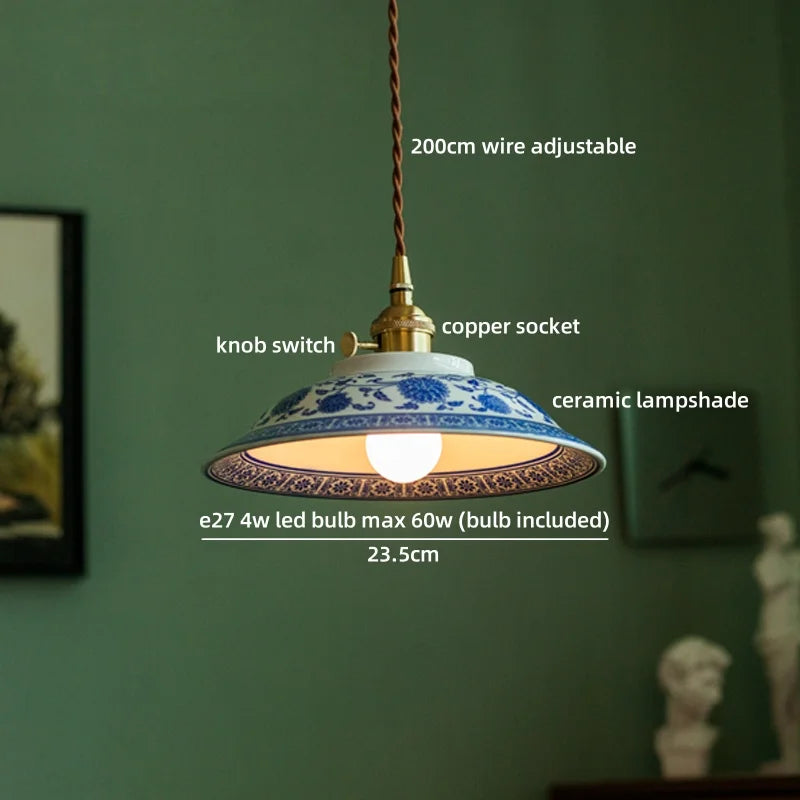 Lamp with ceramic shade and labeled features on a green wall background