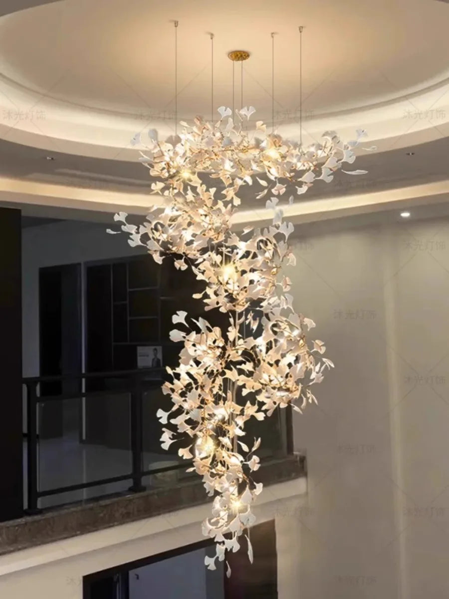 Elegant chandelier hanging in a modern indoor setting with neutral colors.