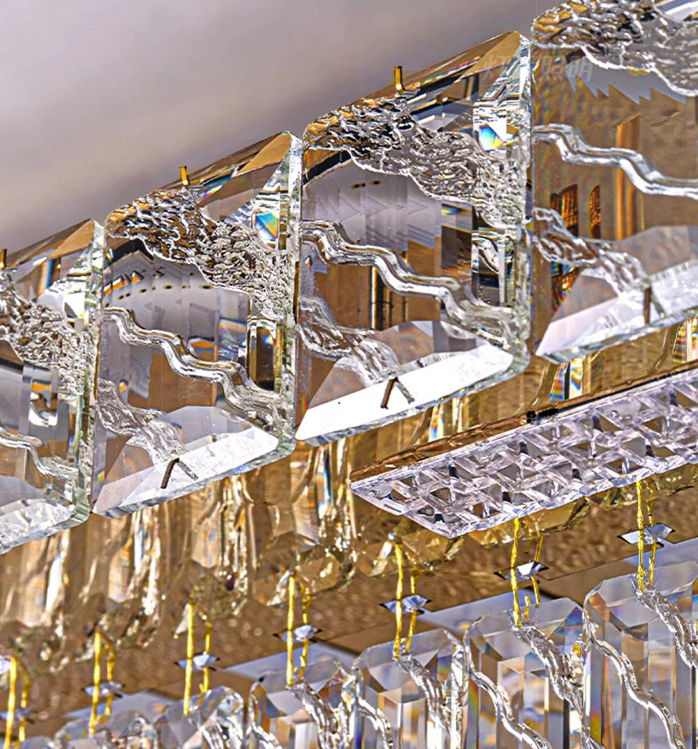 Close-up of a crystal chandelier with gold accents