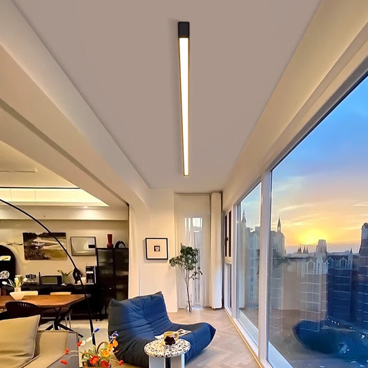White linear bar ceiling light fixture mounted on a modern white ceiling, casting a soft glow.