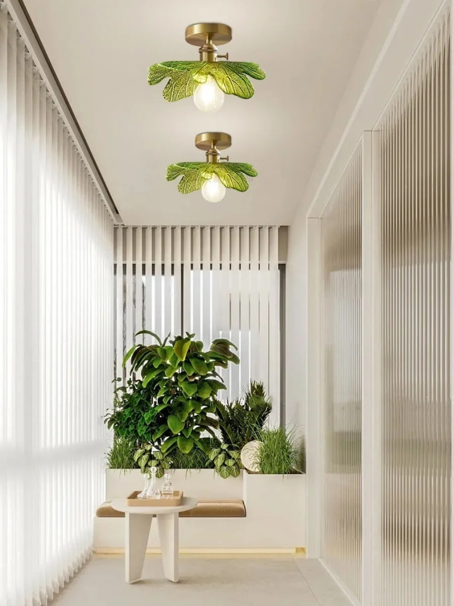 Modern interior design with green ceiling lights and plants.