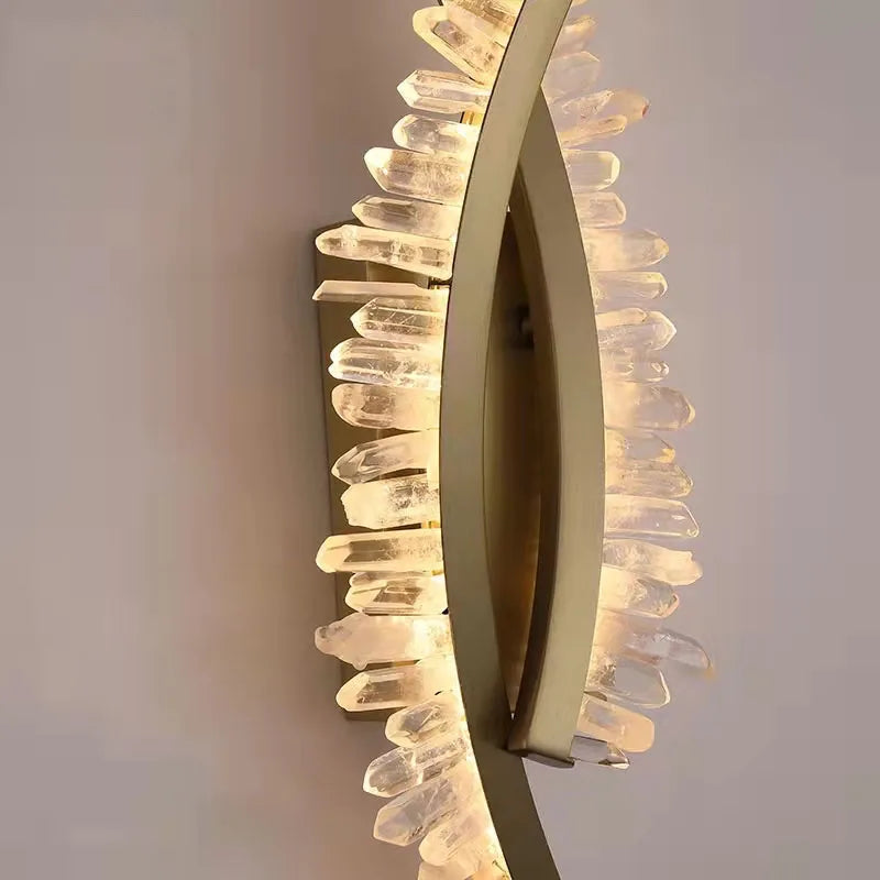 Modern wall light fixture with a decorative design on a neutral background