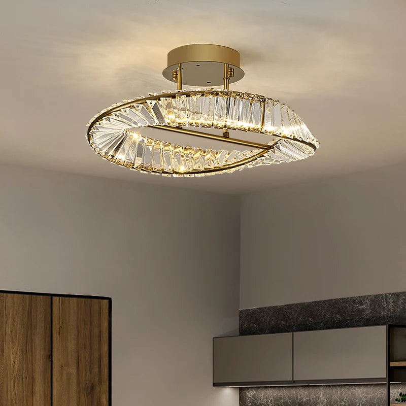 Modern ceiling light fixture with crystal accents in a room setting.