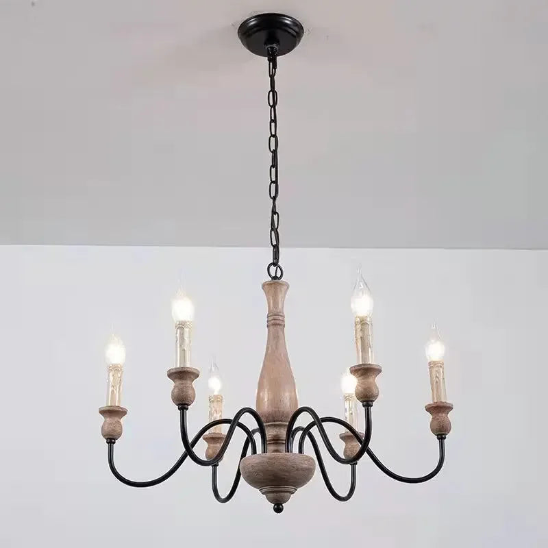 Wooden chandelier with black metal accents on a white background