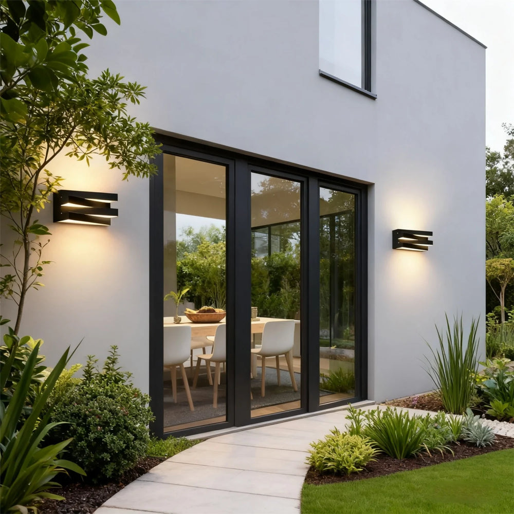 Modern house exterior with glass doors and outdoor lighting