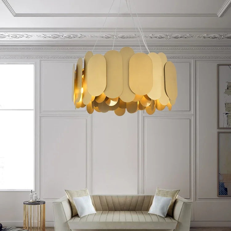 Gold oval link chandelier in a well-lit living room setting