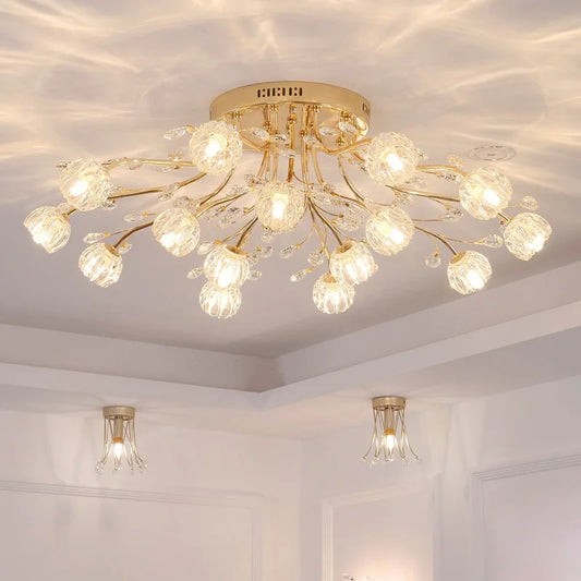 Gold semi-flush mount ceiling light with floral design and crystal accents, shown in a room with recessed lighting