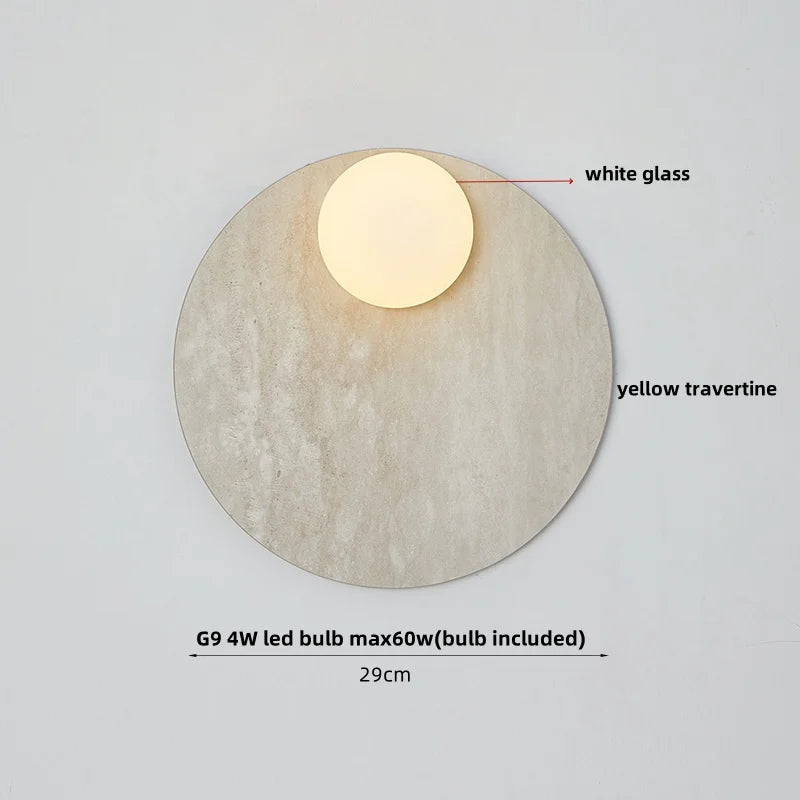 Wall light fixture with white glass cover and yellow travertine base on a gray background