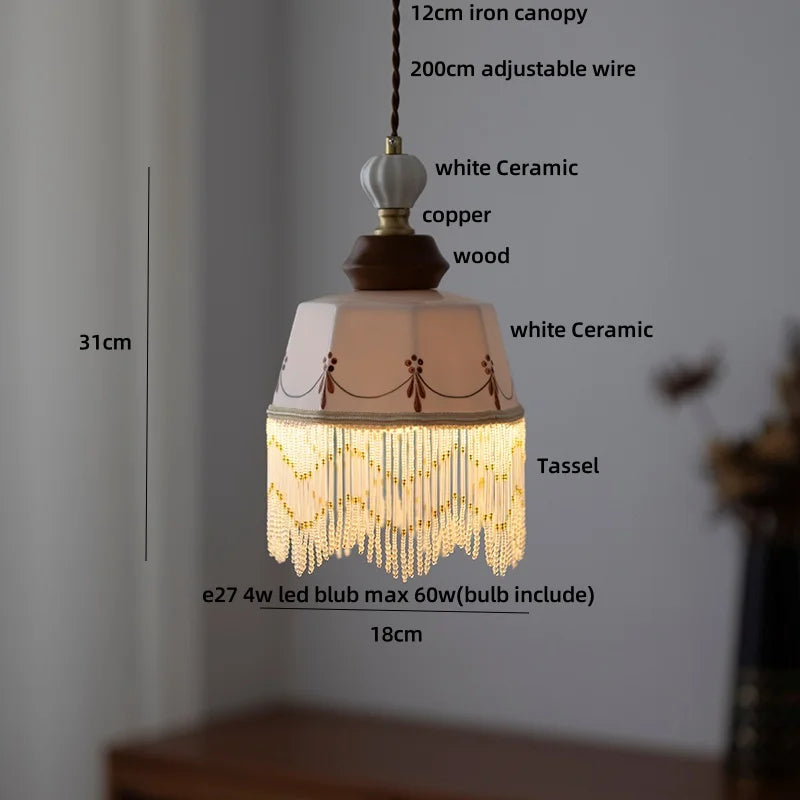 Pendant light with tassel and measurements on a neutral background