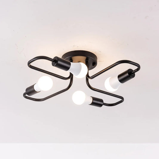 Black metal starburst semi-flush ceiling light fixture with four exposed LED bulbs