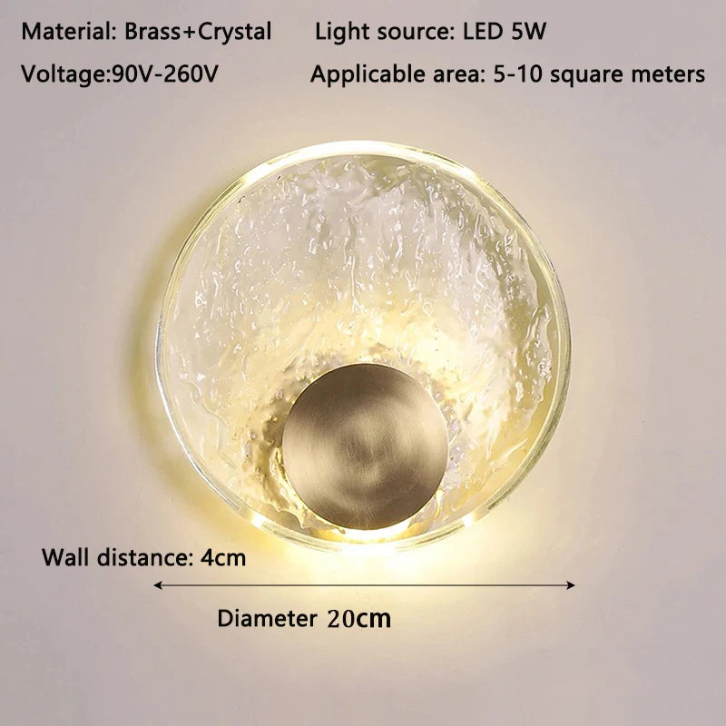 Wall-mounted light fixture with brass and crystal design, labeled with specifications.