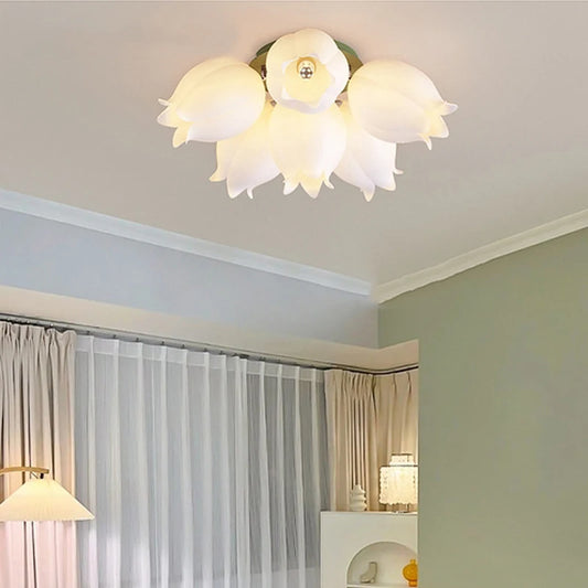 White orchid blossom flush mount ceiling light installed in a room with curtains
