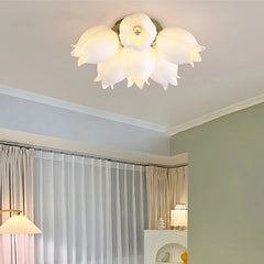 White orchid blossom flush mount ceiling light installed in a room with curtains