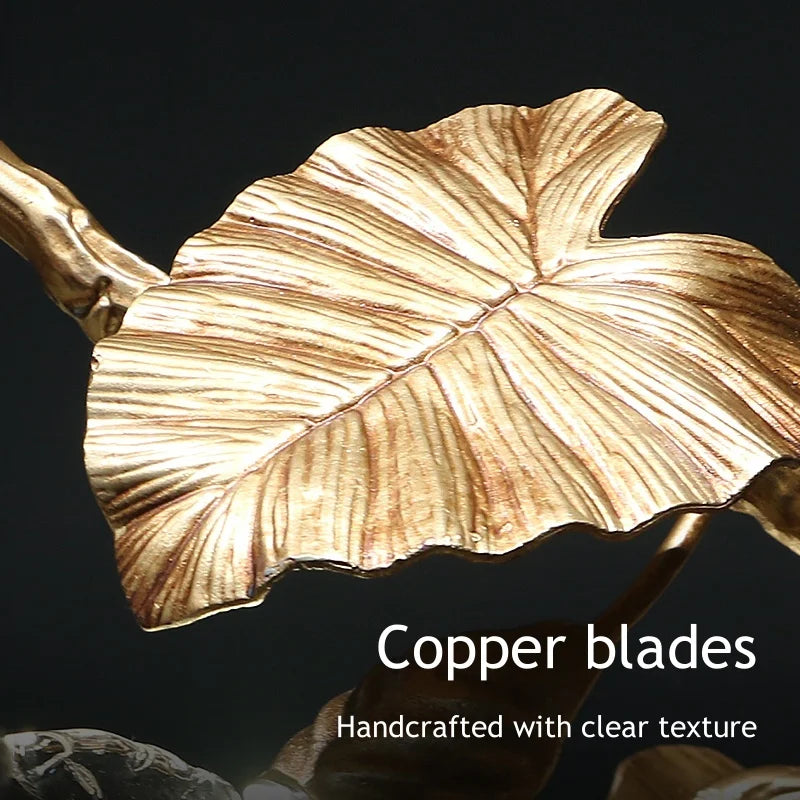 Copper leaf-shaped object with 'Copper blades' text on a dark background