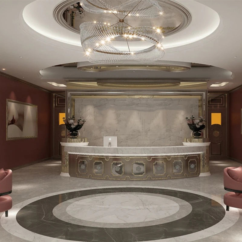 Luxurious interior with a marble reception desk and chandelier
