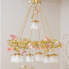 A gold pendant light with detailed pink rose and leaf ceramic embellishments, showcasing its hanging structure and light shades.