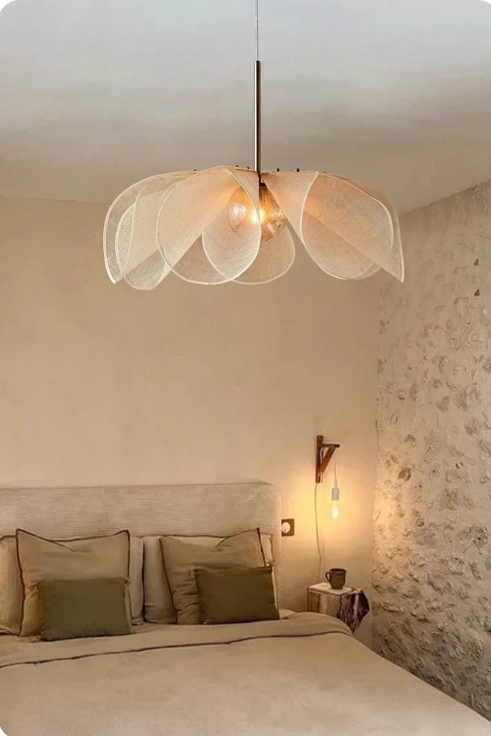 Modern bedroom with a unique pendant light fixture.