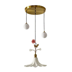 Close-up of the gold floral rose bud ceramic pendant light against a white background