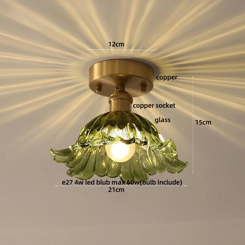 Ceiling light fixture with green glass shade and measurements on a beige background