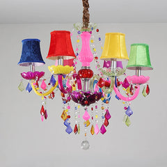 A whimsical chandelier with colorful fabric shades (blue, red, yellow, green) and cascading crystals, designed for a child's room or princess-themed decor.