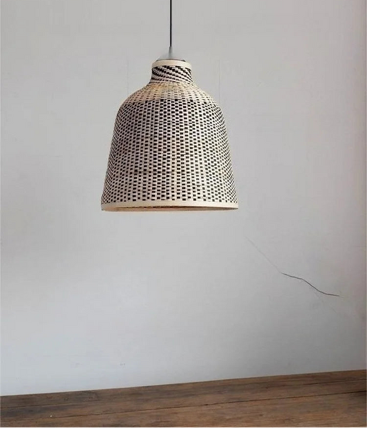 Close-up of a rattan woven bell pendant light with a patterned design
