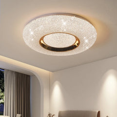 Circular flush mount ceiling light with a textured white surround and a central gold ring, studded with small sparkling lights.