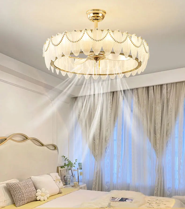 Ceiling light fixture in a bedroom setting with a bed and curtains.
