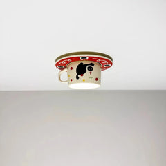 Angled view of the ceramic coffee cup flush mount ceiling light against a white ceiling