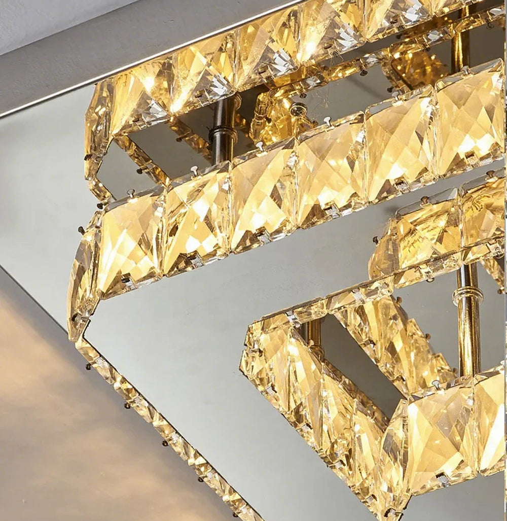 Gold chandelier with crystal-like design on a neutral background