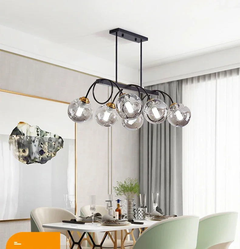 Modern chandelier with glass shades in a dining room setting