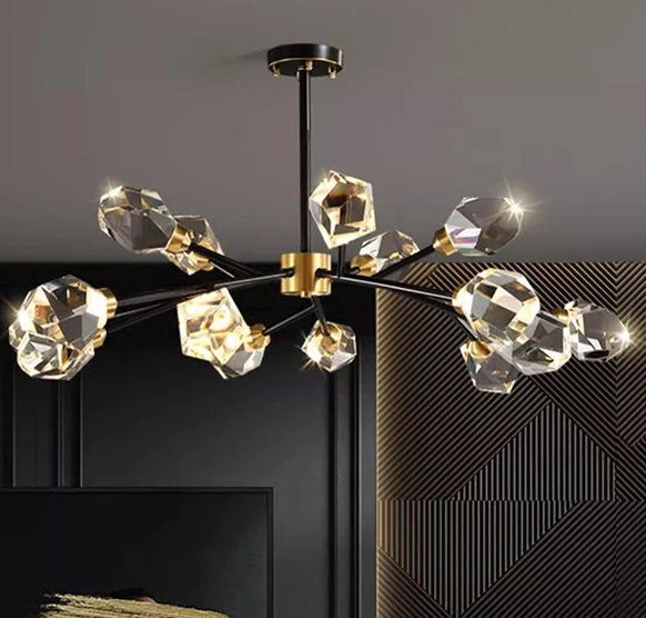 Modern chandelier hanging above a living room with a sofa and decor.