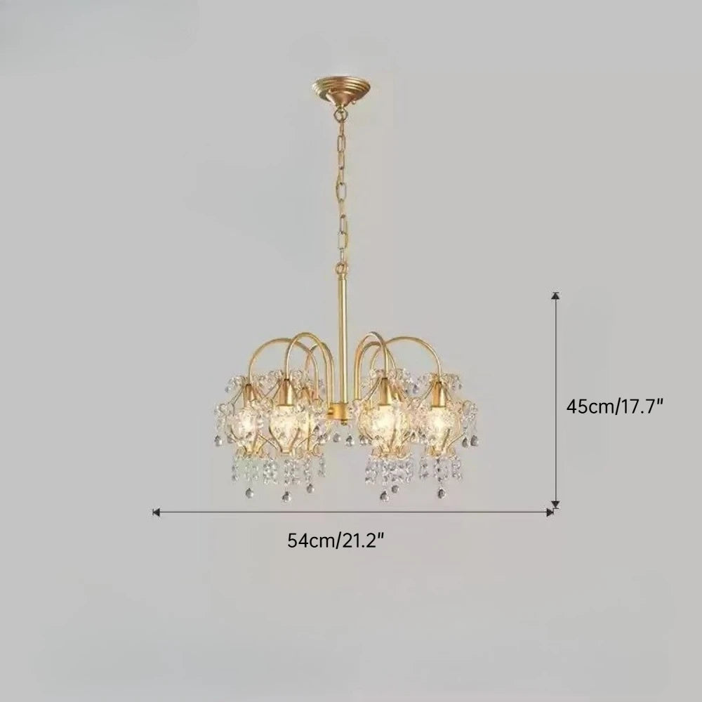 Gold chandelier with crystal accents on a gray background, showing dimensions.