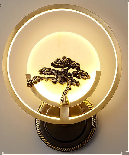 Wall lamp with tree design and dimensions on a gray background