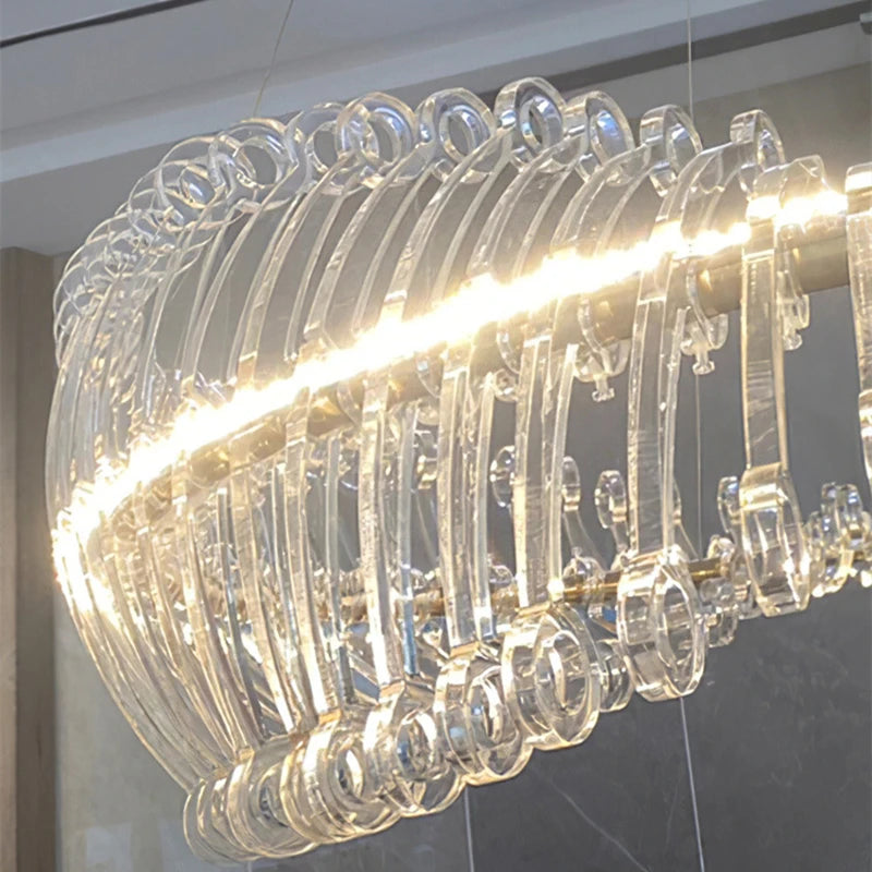 Modern chandelier with clear glass rings and warm light