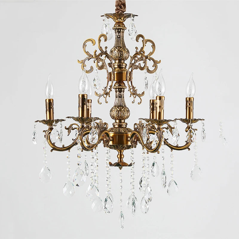 Front view of a coppery multi-arm chandelier adorned with crystal accents and faux candle bulbs.