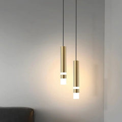 Two gold cylindrical pendant lights with white light strips, hanging at different heights.