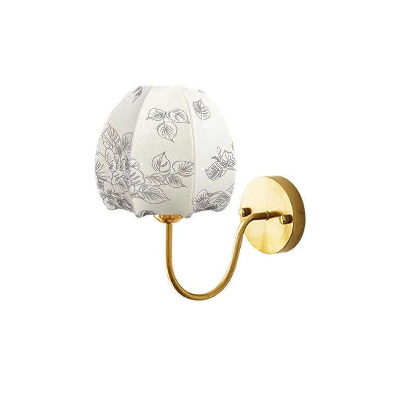 Wall-mounted light fixture with floral-patterned shade on a white background