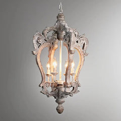 Decorative pendant light with intricate design on a gray background