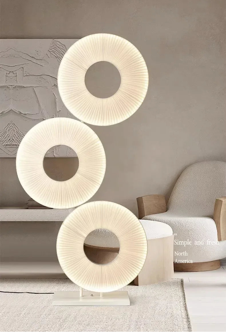 Decorative wall lights with circular design in a living room setting.