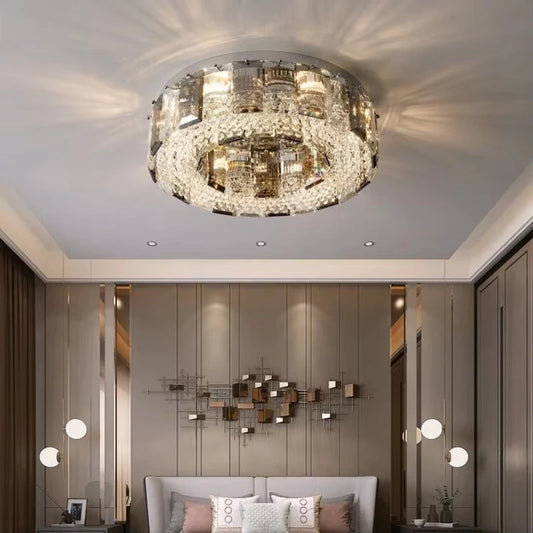A luxurious living room featuring a large, round semi-flush ceiling light with crystal accents, casting a warm glow.