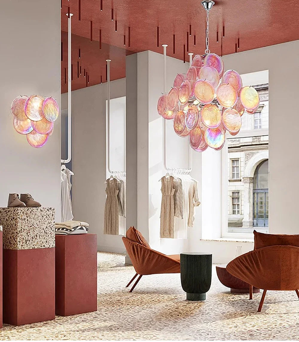 Modern interior design with colorful glass chandelier and furniture.